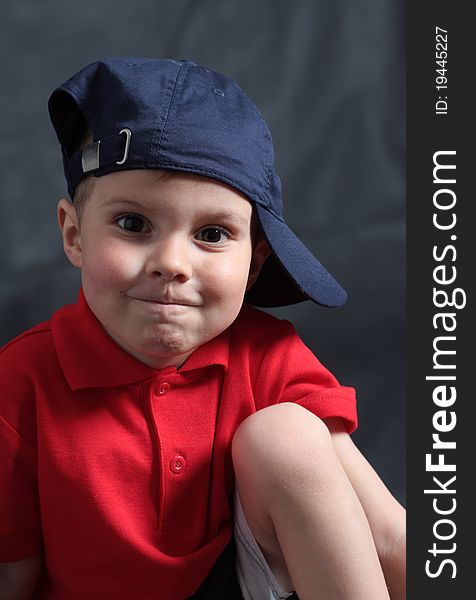 Portrait of the boy of four years in a baseball cap