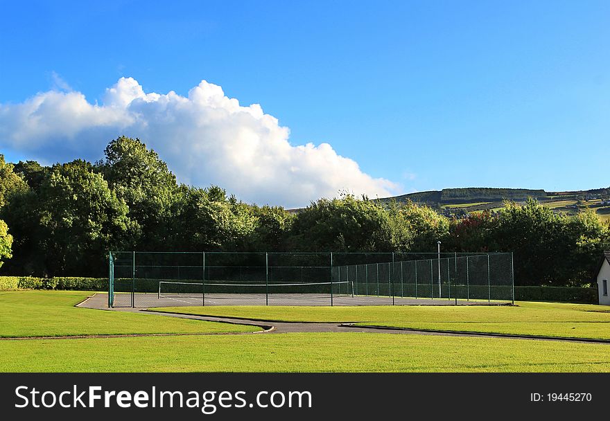 A tennis court in a beautiful nature place