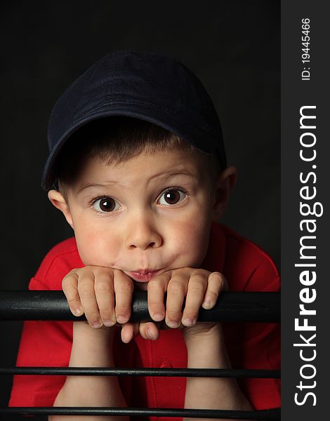 Portrait of the boy of four years in a baseball cap