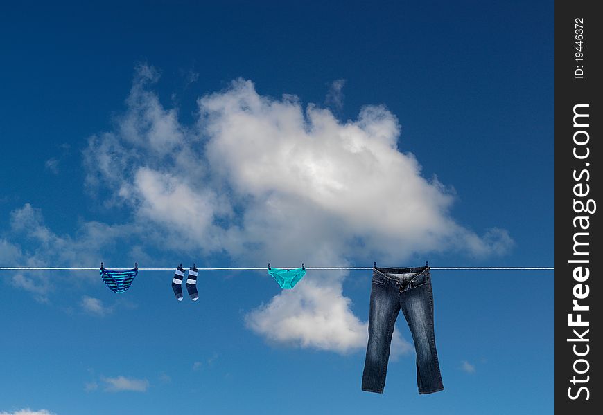Clothes on a clothes line against a blue sky