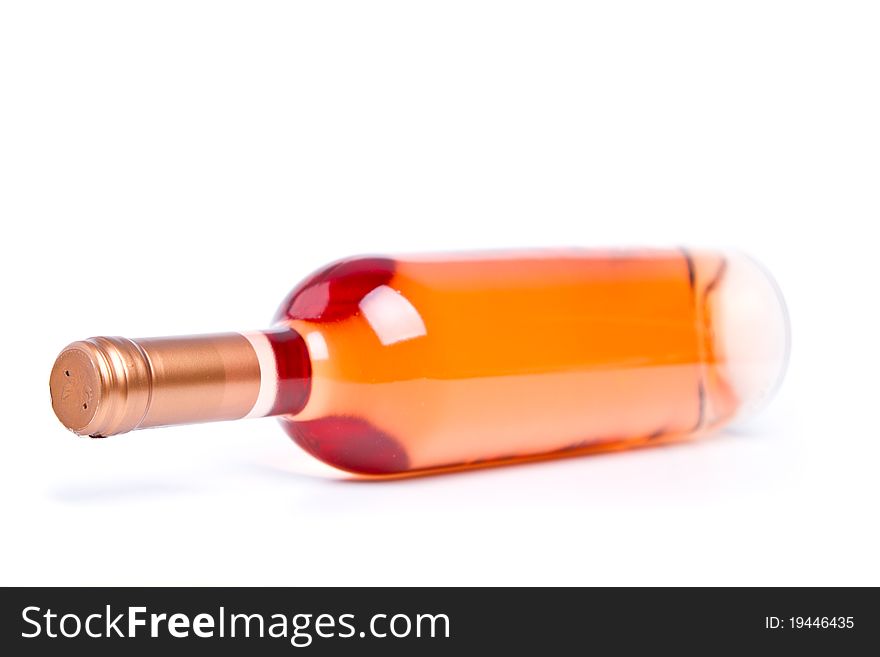 Rose wine in unmarked bottle (shallow DOF). Rose wine in unmarked bottle (shallow DOF)