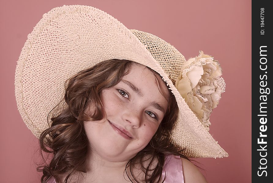 Young girl wearing a large brimmed souther hat. Young girl wearing a large brimmed souther hat.