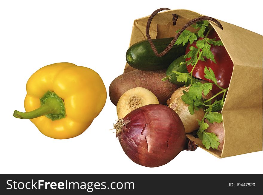 Vegetables in a paper package on the white isolated background. Vegetables in a paper package on the white isolated background