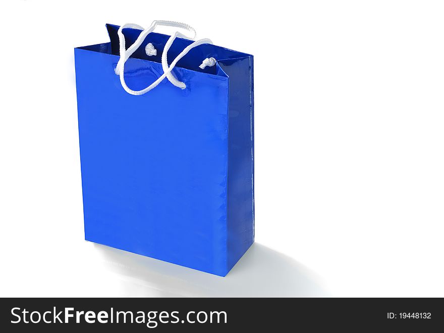 Blue paper bag isolated on white background