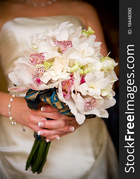 A bride holding her wedding bouquet