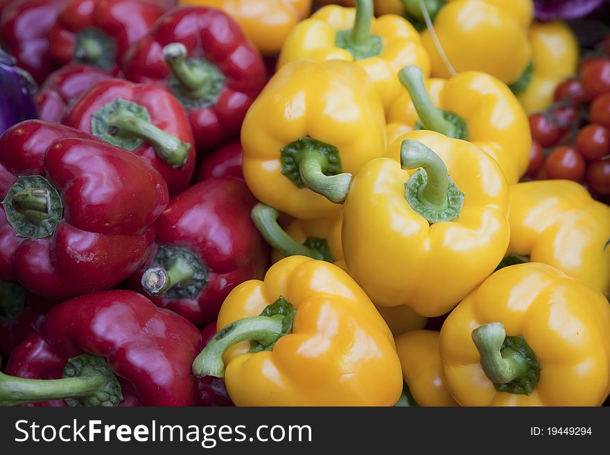 Red an yellow peppers on sale on market stall