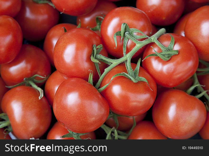 Close up of tomatoes for sale on market stall. Close up of tomatoes for sale on market stall