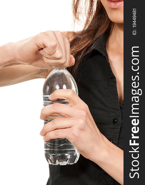 Fitness woman open drinking sparkling mineral  bottled  water isolated on a white background. Fitness woman open drinking sparkling mineral  bottled  water isolated on a white background