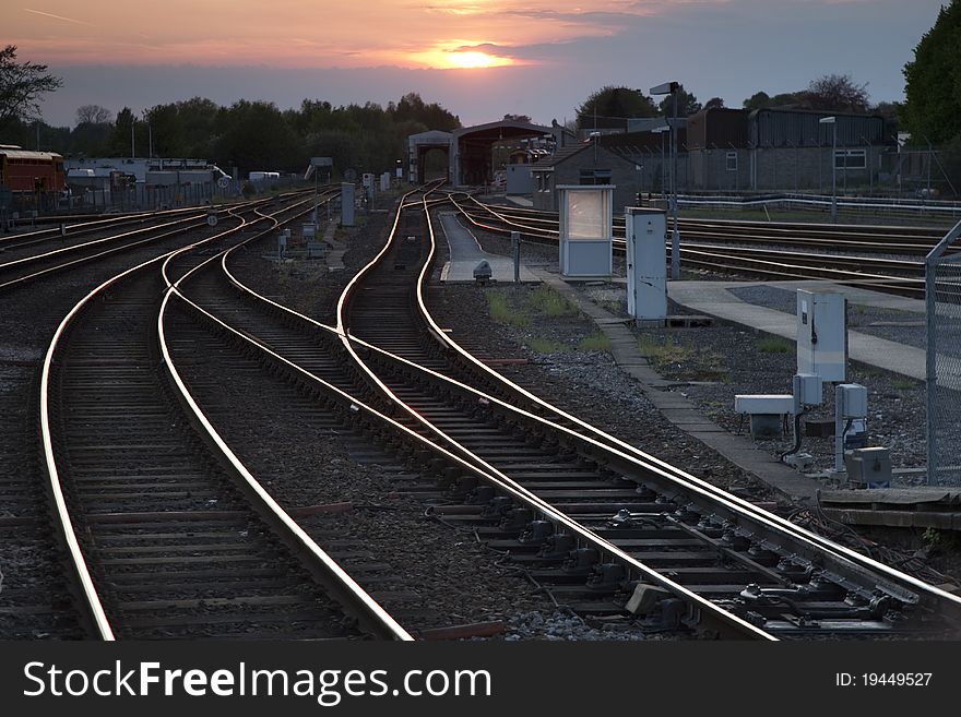 Railway Tracks at Dusk in Urban Setting