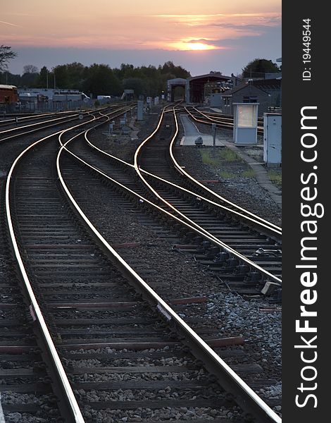 Railway Tracks at Dusk in Urban Setting