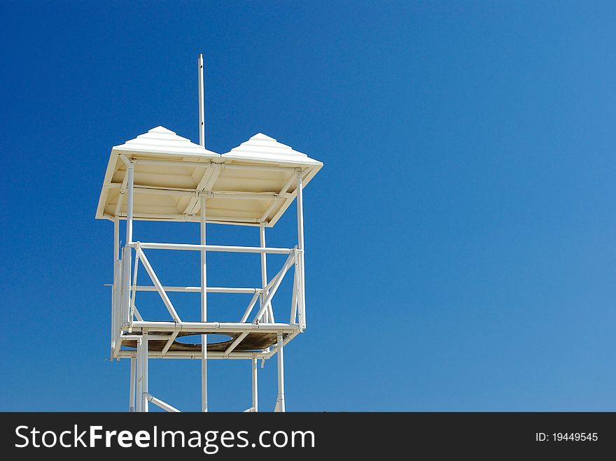 A lifeguard watchtower against sky background. A lifeguard watchtower against sky background