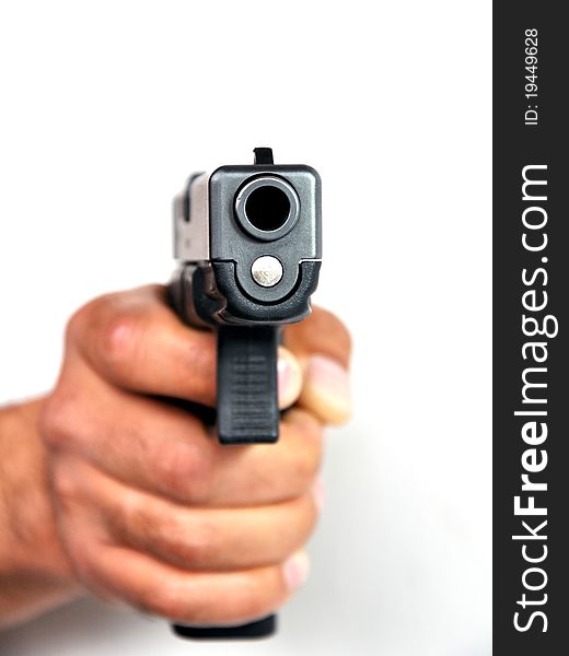 Pistol In A Man S Hand On A White Background.