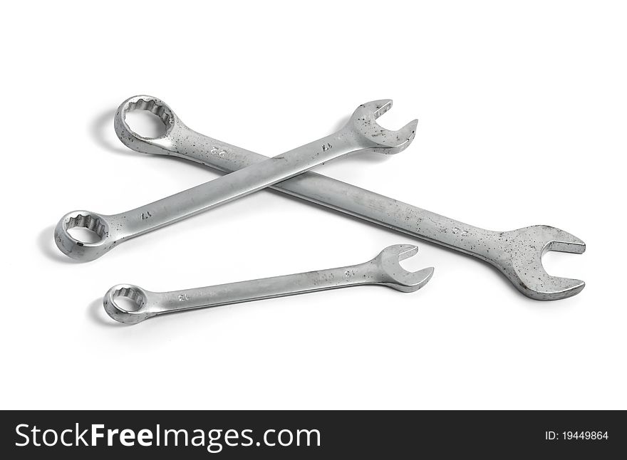 Three box and pin-face wrenches of different sizes isolated on white background