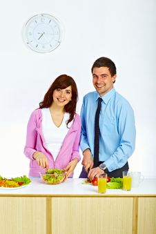 Couple Preparing A Salad For Lunch Stock Photos