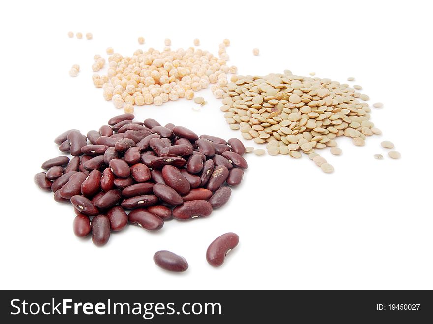 Red haricot, lentil and peas isolated on white
