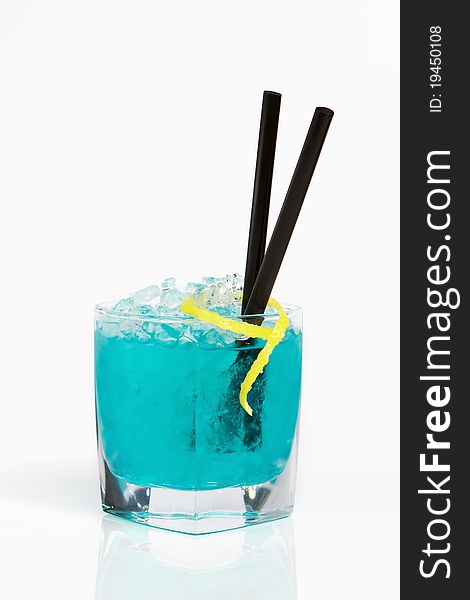 Photo of refreshing blue alcohol cocktail on crushed ice. Photo of refreshing blue alcohol cocktail on crushed ice