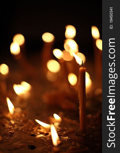 Church prayer candles in the dark