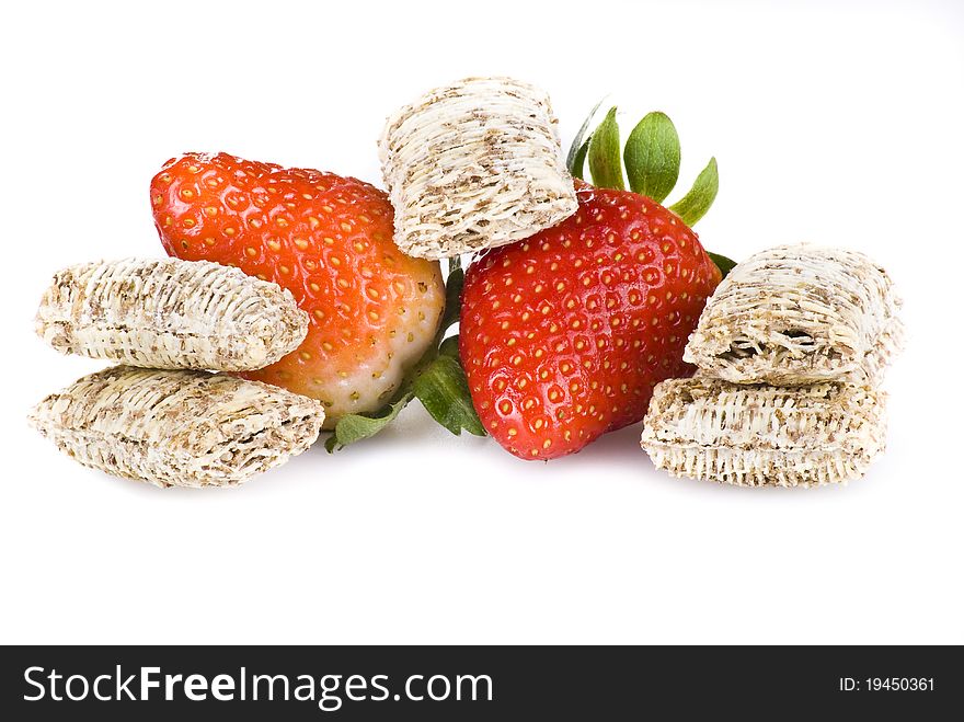 Wheat cereal with strawberries over white background - isolated