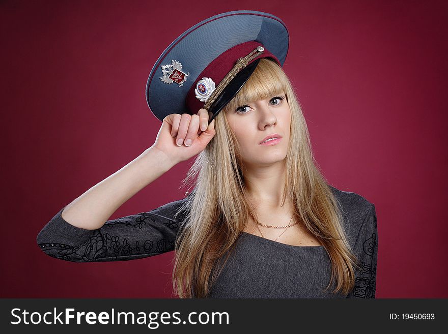 Attractive sexy blond woman in service cap