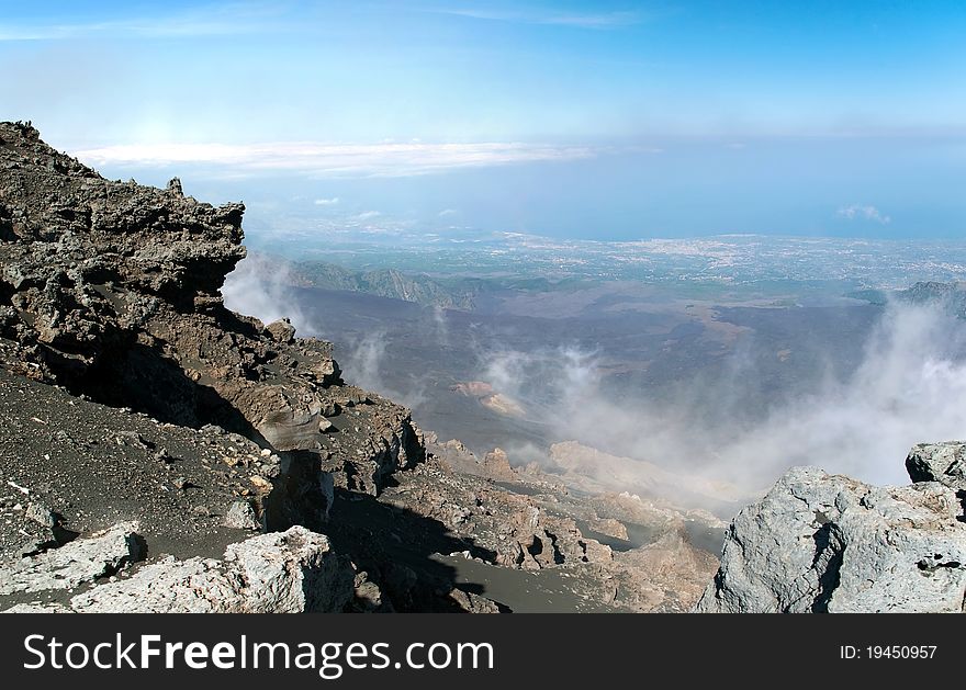 Panoramic view from mount Etna with sea and towns beneath, Sicily, Italy