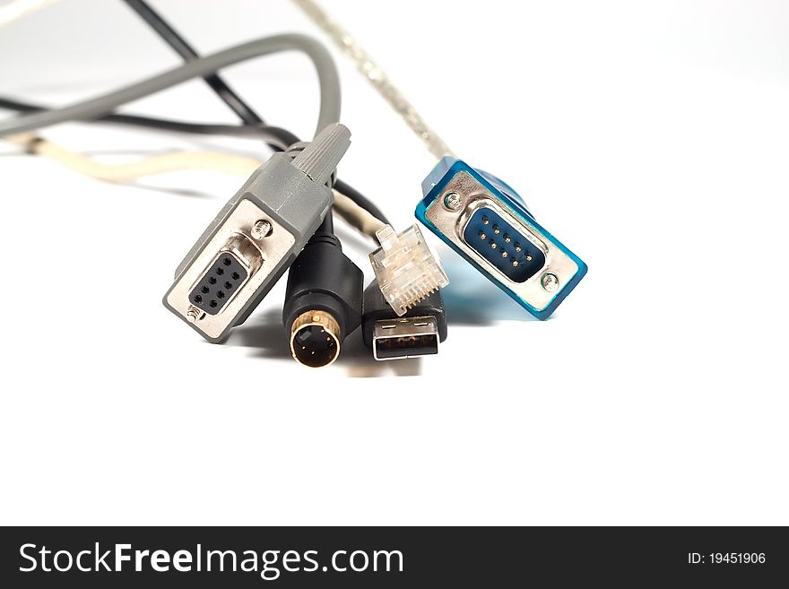 Five computer cables on white background