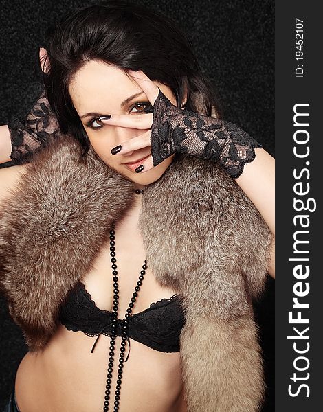 Young sexual woman in the gloves and the fur. Young sexual woman in the gloves and the fur