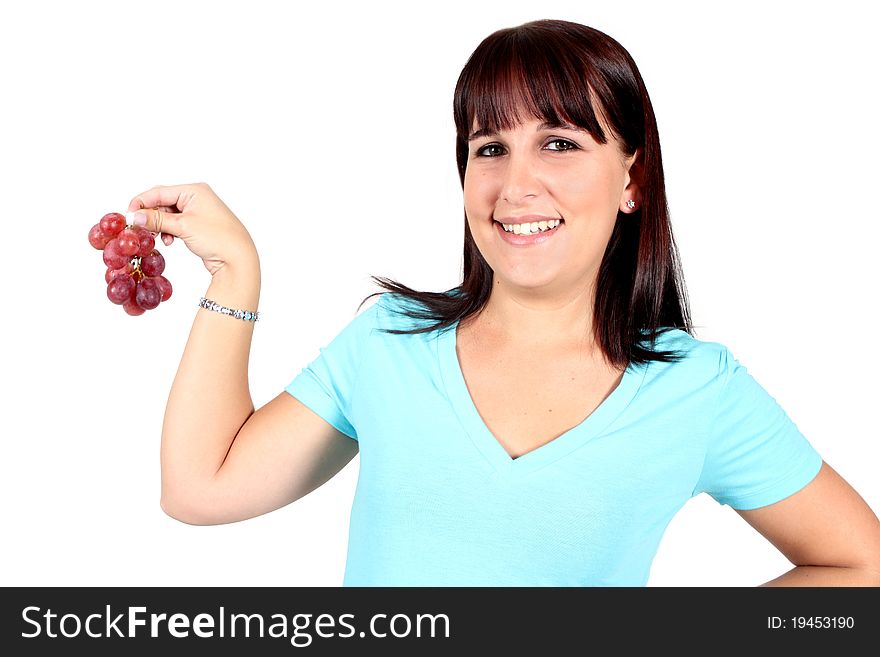 Woman holding a bunch of red grapes on a white background. Woman holding a bunch of red grapes on a white background