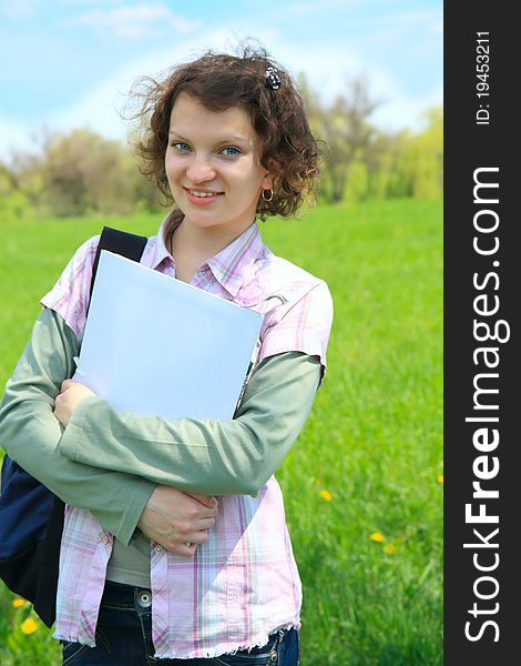 A Female Teenage Student In summer Park