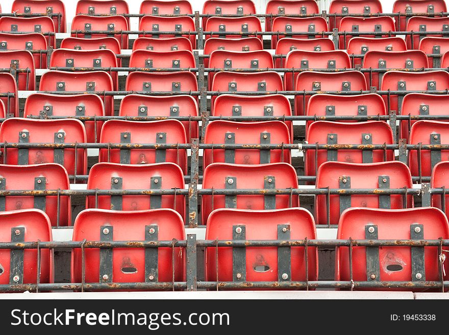 Folded red stadium seat in rows. Folded red stadium seat in rows