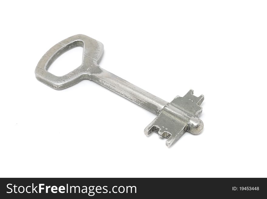 A vintage key isolated on a white background. A vintage key isolated on a white background