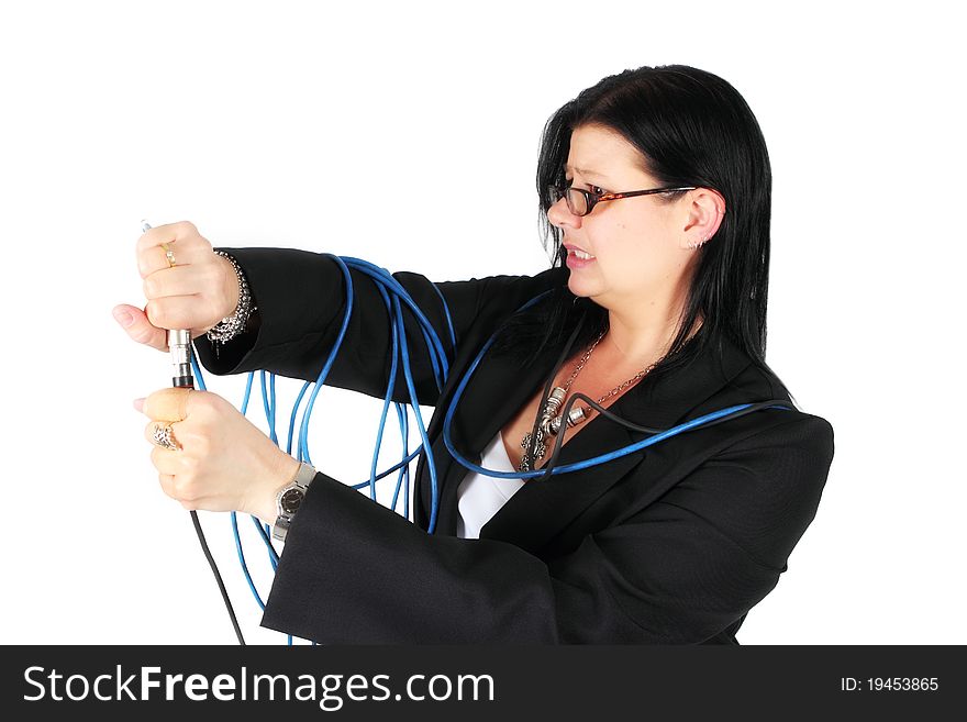 Woman plugging in cables with worried look on her face