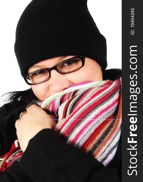 Girl in winter clothes with scarf over face and hat