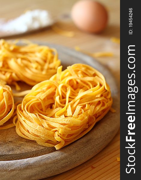 Uncooked delicious italian pasta tagliatelle