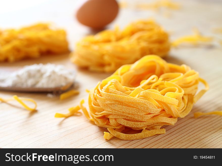 Uncooked delicious italian pasta tagliatelle