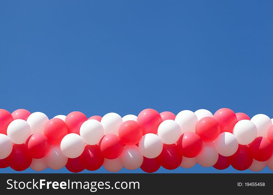 Sheaf of balloons against the sky