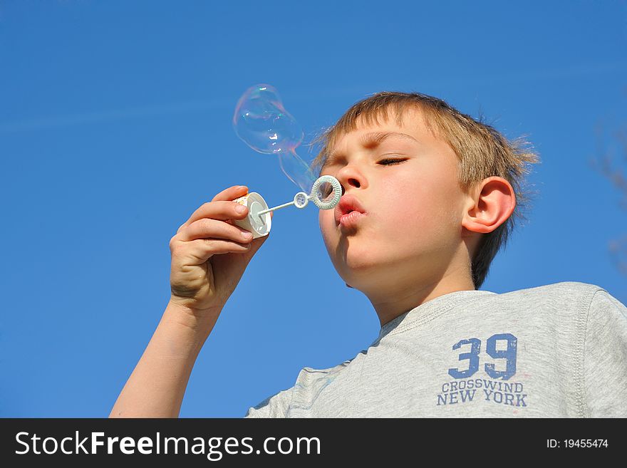 Blonde Boy With Soap Bubbles