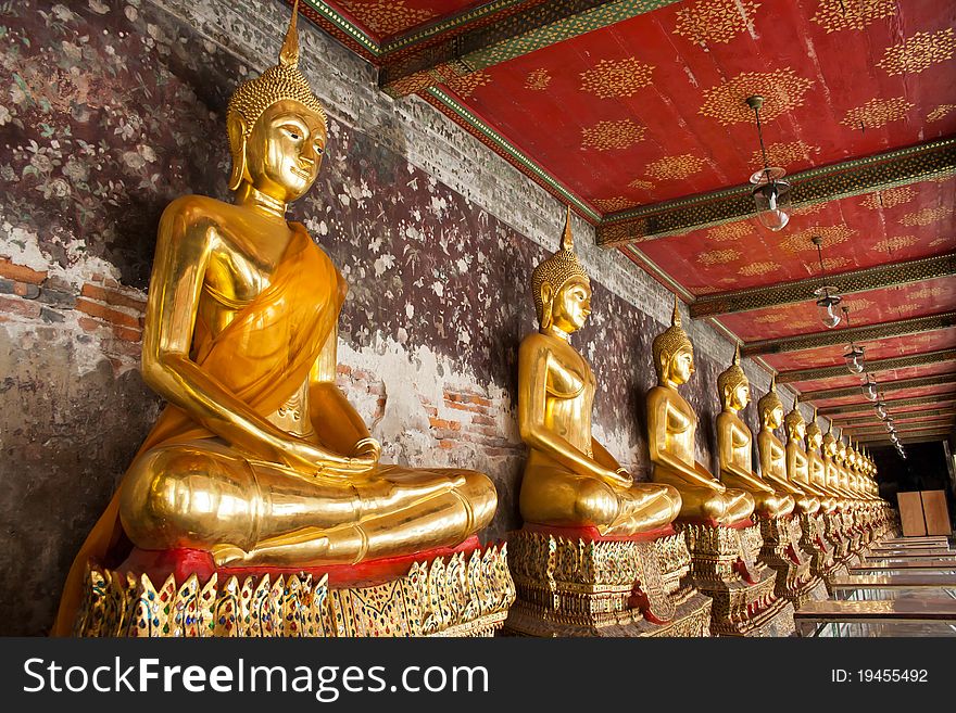 Gold Buddha statues in a temple, Bangkok, Thailand. Gold Buddha statues in a temple, Bangkok, Thailand.