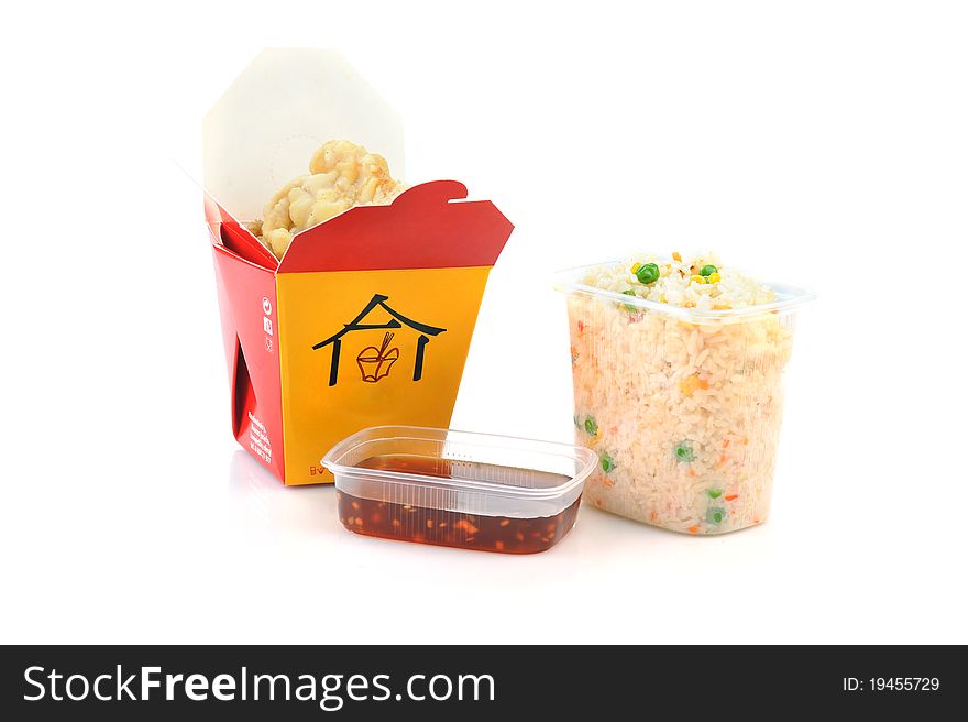 Grilled meat and rice with vegetables in disposable containers. Chinese cuisine