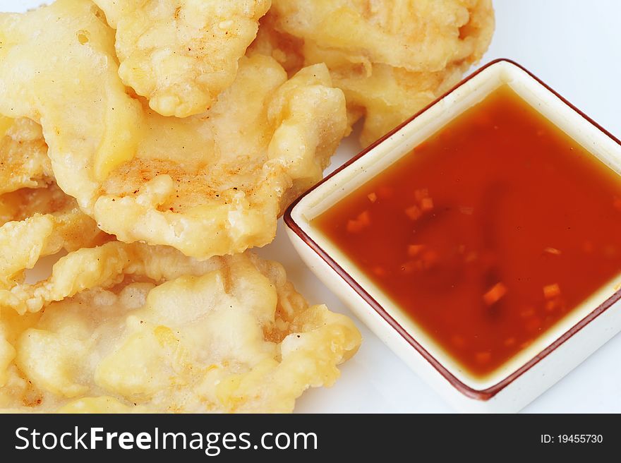 Deep fried chicken with red sauce. chinese cuisine