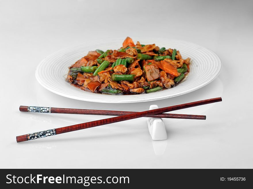 Chinese cuisine. deep fried chicken with red sauce and beans. Chinese cuisine. deep fried chicken with red sauce and beans