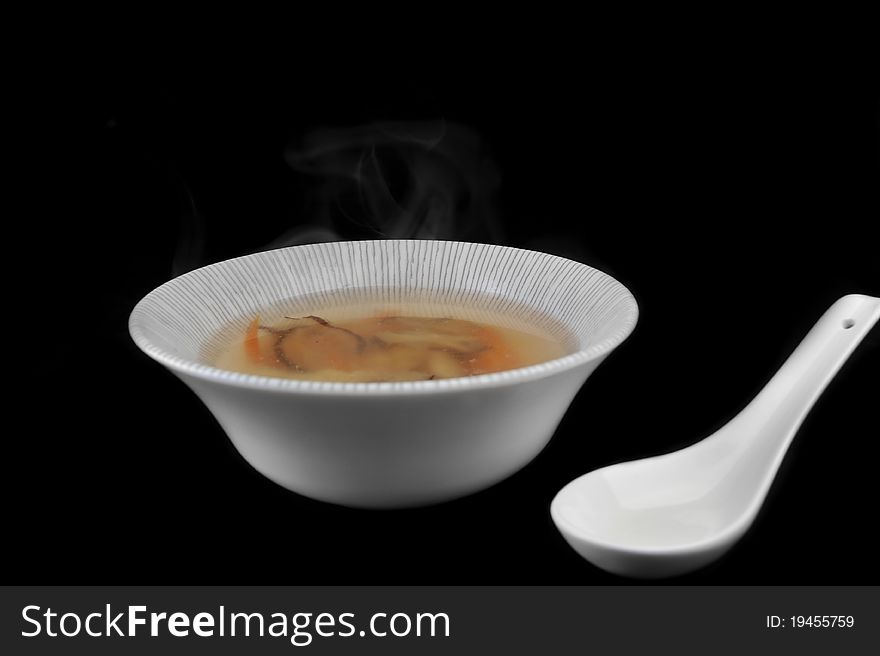 Bowl with delicious mushroom soup. Chinese cuisine. Bowl with delicious mushroom soup. Chinese cuisine