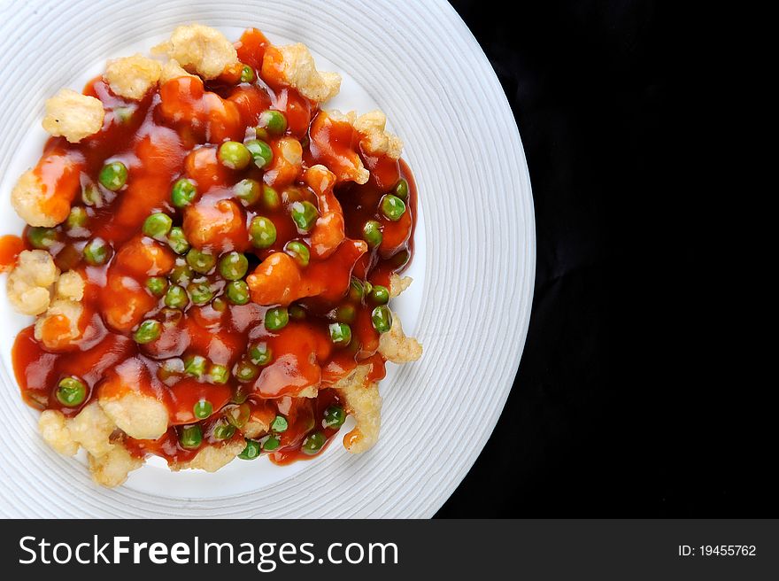 Deep fried chicken with red sauce. chinese cuisine