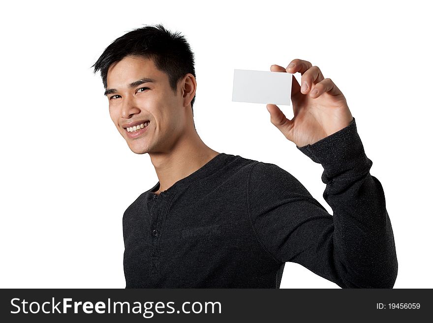 Man smiling as he holds up a small blank card off to one side. Man smiling as he holds up a small blank card off to one side