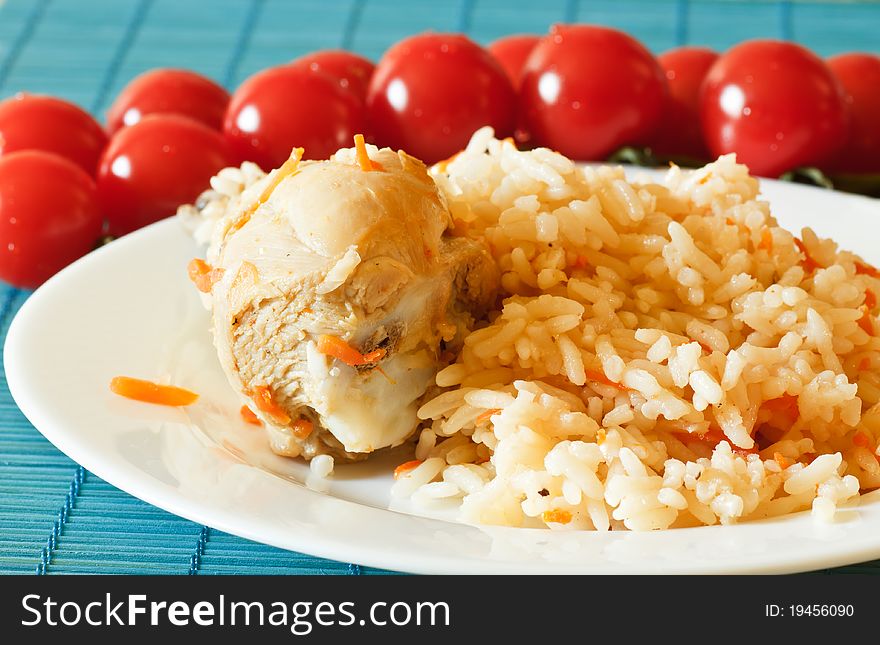 Delicious pilaf with chicken on a plate