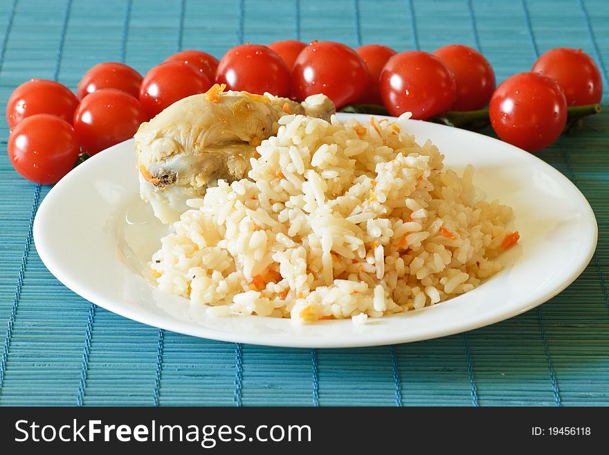 Delicious pilaf with chicken on a plate