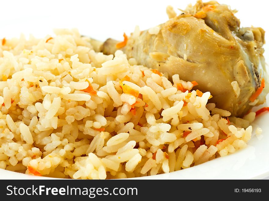 Delicious pilaf with chicken on a plate