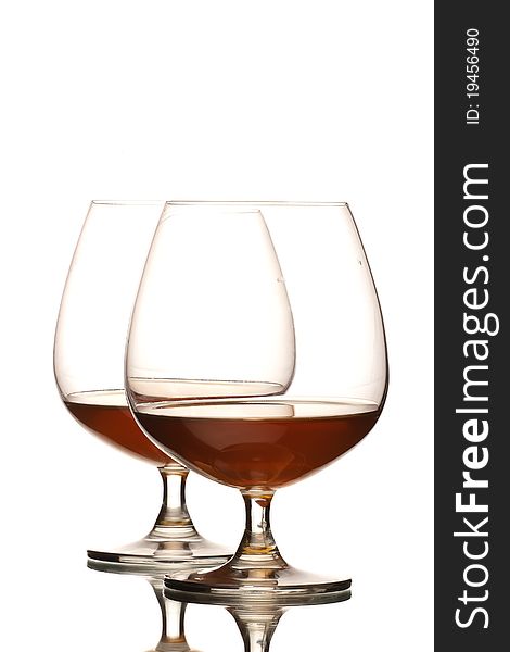 Two glasses of cognac isolated over white