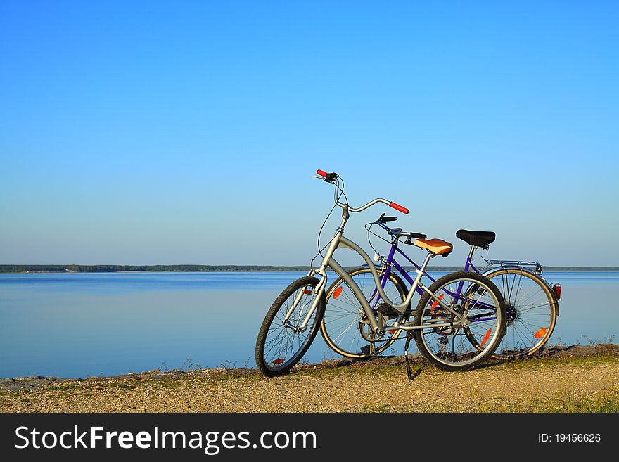 Bicycles parking on the lake before sunset. Bicycles parking on the lake before sunset