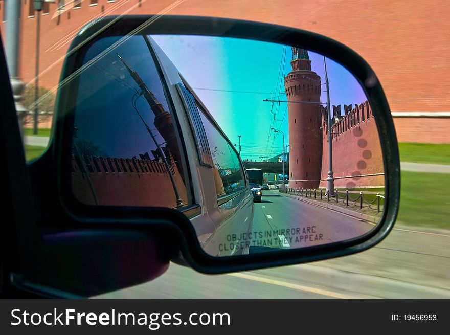 City view reflection in auto mirror