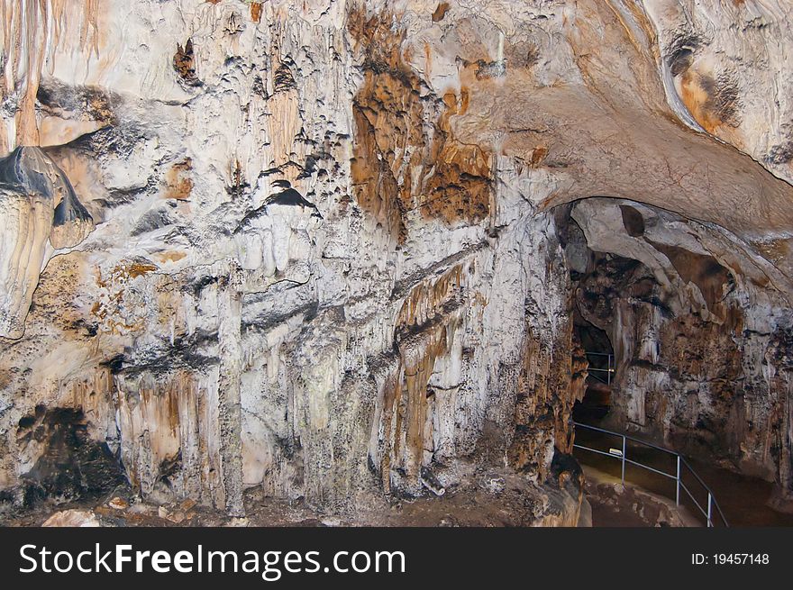 The formation of stalactites and stalagmites in a cave. The formation of stalactites and stalagmites in a cave